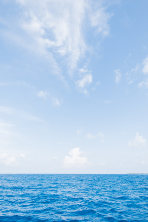 Calm Sea and Blue Sky Background in Maldivesの写真素材