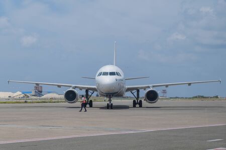 Male, Maldives - Airplane and engine at Velana International Airport in Male, Maldives on April 22, 2019のeditorial素材