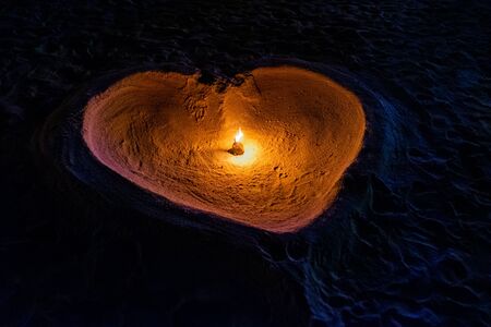 Romantic candlelight heart on the beach in Lipe island, Thailandの写真素材