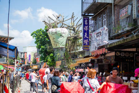 Taipei, Taiwan - Many peopleare Launching Sky Lantern Along Railway  at Shifen Old Street,Taiwan. on Oct 5, 2019のeditorial素材