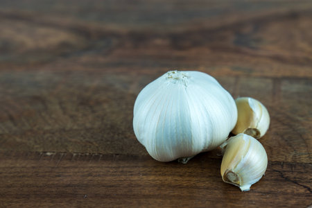 garlic on a wooden texture tableの写真素材