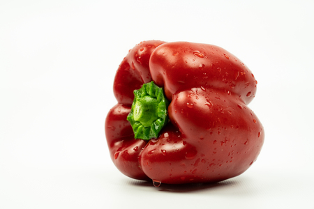 red pepper lying down on his side. Isolated on a white backgroundの写真素材