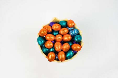 chocolate Easter eggs in a bowl, top viewの写真素材