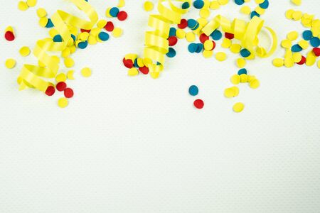 confetti on a white background with space beneath it for your own textの写真素材