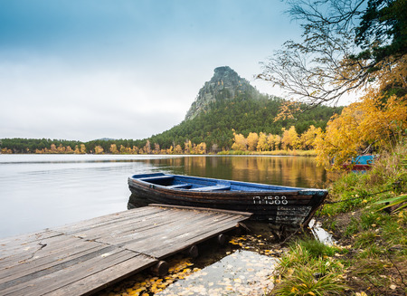 Pier and boat on the lake in the evening Burabai, now is quiet and peaceful, northern Kazakhstan.の写真素材