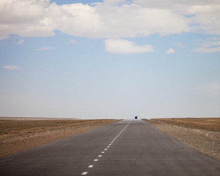 Road disappearing into the skyの写真素材