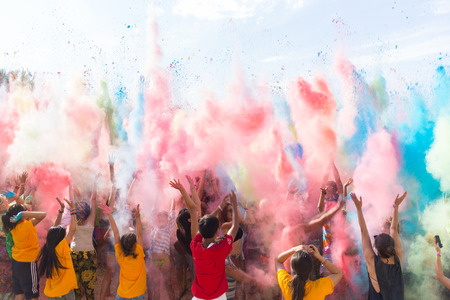 a crowd of people dancing on a colorful festival of colorsのeditorial素材