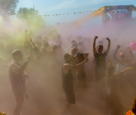a crowd of people dancing on a colorful festival of colorsのeditorial素材
