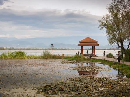 Chinese park with a pond and boatsのeditorial素材