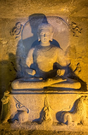 Cracked surface of old Buddha statue, decline of Buddhism conceptの写真素材