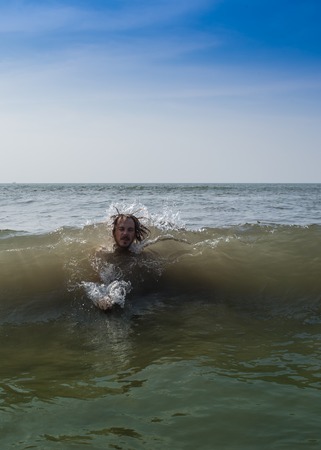 Man having fun laying in the Indiaの写真素材