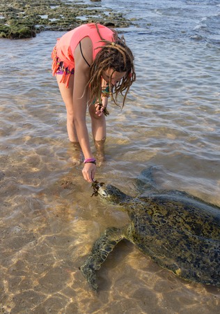 Beautiful woman in bikini sunbathing at the  seasideの写真素材