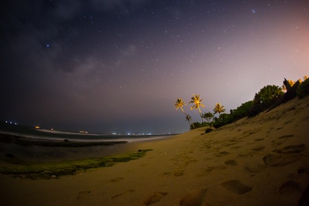 month on a background star sky reflected in the seaの写真素材