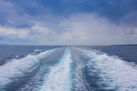 The boat floating in the blue Dnieper watersの写真素材