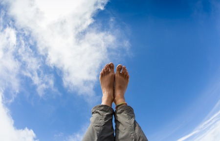 Feeling relaxed and letting the bare feet air out in the sun.の写真素材