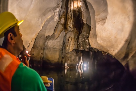 Unique image of Puerto Princesa subterranean underground river from inside - Dark lighting with the real feeling from visitor's point of viewの写真素材