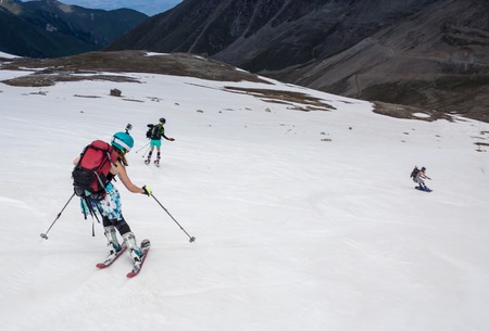 Full length of skier skiing on fresh powder snowの写真素材