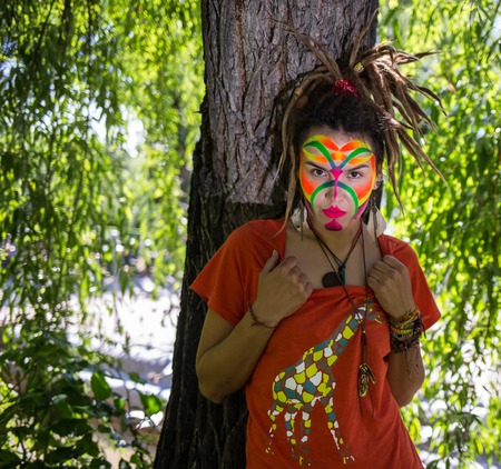 Bright make-up with a pattern on the face of a beautiful girlの写真素材