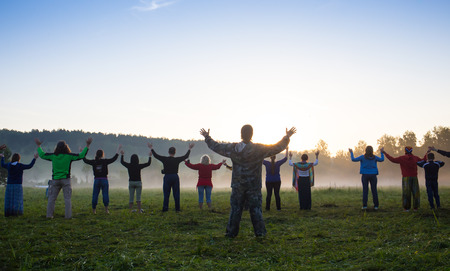 Cosmos Village, Almaty Province, Kazakhstan - 16 August 2015: Large group of happy peoples play roundelay and stand in circle in the park on the green grass on sunny summer day, view from aboveThe festival of ethnic music Forey, a lot of people gathers onのeditorial素材