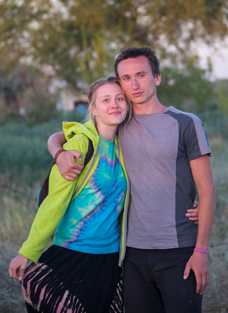 Cosmos Village, Almaty Province, Kazakhstan - 16 August 2015: The festival of ethnic music Forey, a lot of people gathers on this holiday to relax and have  fun. Ethnic open-air concert, where many people gathered. Portrait of young mysterious couple in aのeditorial素材