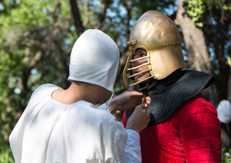 Glistening Knight holding handed sword in the forestの写真素材