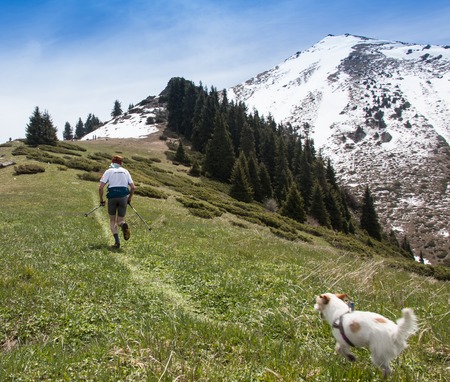 ALMATY, ALMATY DISTRIKT, KAZAKHSTAN - MAY 22, 2016: Open competition SKY RANNING 2016 held in Eliksay gorge. A man runs up to the mountain named Bukreeva participating in the competition.のeditorial素材