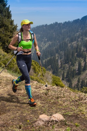 ALMATY, ALMATY DISTRIKT,KAZAKHSTAN - MAY 22, 2016: Open competition SKY RANNING 2016 held in Eliksay gorge. A girl runs up to the mountain named Bukreeva participating in the competition.のeditorial素材