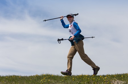 ALMATY, ALMATY DISTRIKT,KAZAKHSTAN - MAY 22, 2016: Open competition SKY RANNING 2016 held in Eliksay gorge. A girl runs up to the mountain named Bukreeva participating in the competition.のeditorial素材