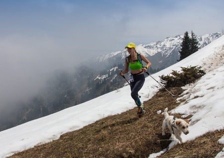 ALMATY, ALMATY DISTRIKT,KAZAKHSTAN - MAY 22, 2016: Open competition SKY RANNING 2016 held in Eliksay gorge. A girl runs up to the mountain named Bukreeva participating in the competition.のeditorial素材