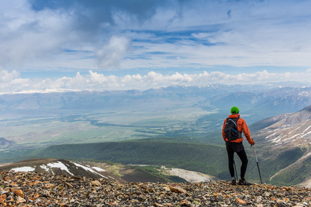 Man hiker on a top of a mountain in Altay, Russiaの写真素材