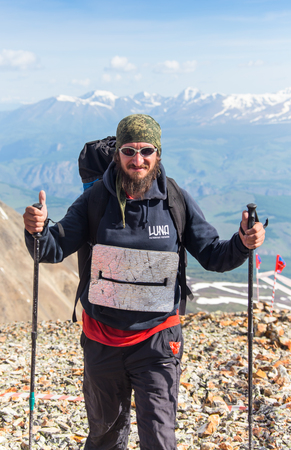 AKTRU,KURDAI,GORNII ALTAI / KAZAKHSTAN - JUNE 10: International Championship in the discipline skyrunning "Aktru 2016". Athletes from different countries compete in the championship in a very beautiful mountains of Altai. A strong man runs up to the titleのeditorial素材