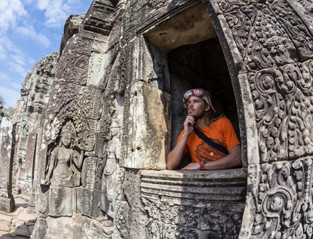 Contemplating monk, Angkor Wat, Siam Reap, Cambodiaの写真素材
