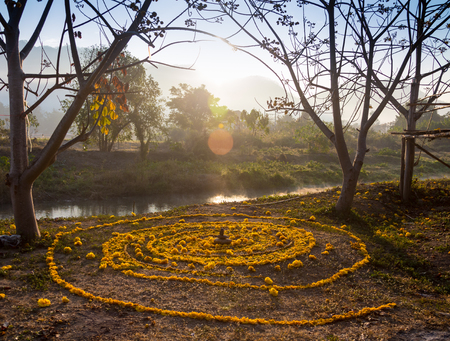 spiral painted on the ground with the help of flower petals to the sun ritual