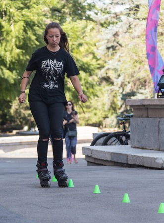 KAZAKHSTAN ALMATY - AUGUST 28, 2016: Urban extreme competition, where the city athletes compete in the disciplines: skateboard, roller skates, BMX. Bmx stunt performed at the top of a mini ramp on a skatepark.Get Away from the Office! - wide-angle shot, lのeditorial素材
