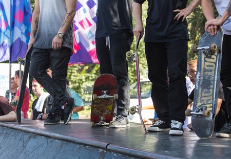KAZAKHSTAN ALMATY - AUGUST 28, 2016: Urban extreme competition, where the city athletes compete in the disciplines: skateboard, roller skates, BMX. Bmx stunt performed at the top of a mini ramp on a skatepark.Winners team on the mountain top. Sport and acのeditorial素材