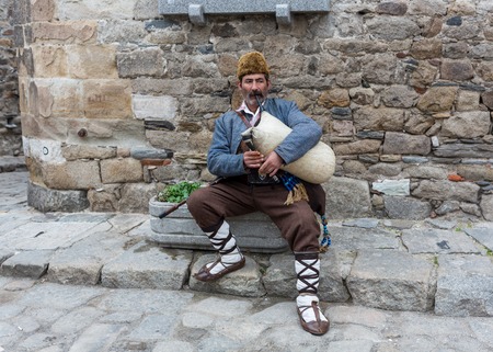 GERMANY, FRANKFURT: 12 DECEMBER 2016 - European street musicians who sitting on the pedestrian streets and playing music for charity.のeditorial素材