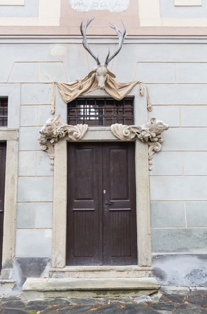 Old red wooden door in Troyes, Franceの写真素材