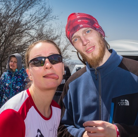 ALMATY, KAZAKHSTAN - APRIL 09, 2017: Amateur competitions - Mountain half-marathon, in the foothills of Almaty, on the Yunat lakes. Young couple runningのeditorial素材