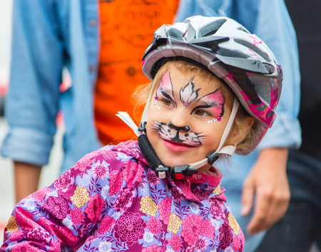 KAZAKHSTAN, ALMATY - JUNE 11, 2017: Childrens cycling competitions Tour de kids. Children aged 2 to 7 years compete in the stadium and receive prizes. Children at the solemn construction - waiting for the start of the competition.のeditorial素材