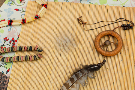 Sewing textile or cloth. Gold scissors pin cushion, and natural white fabric. Work table of a tailor. Shallow depth of field, Focus on scissorsの写真素材