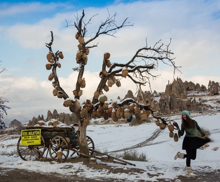 Girl and Clay jugs on old tree branches without leaves in Cappadocia,の写真素材