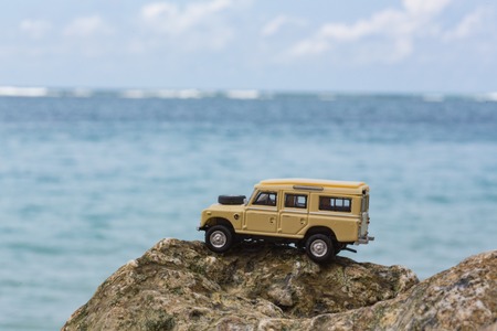 Toy 4x4 Offroad vehicle drives at the beachの写真素材