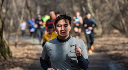 ALMATY, KAZAKHSTAN - March 16, 2019: portrait of a handsome mature unidentified man who runs through...