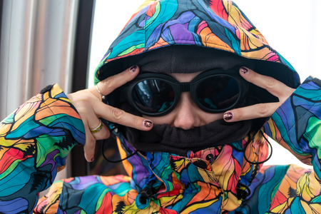 Desperate female trembles and feels cold, huggs herself to warm up, clatter with teeth after walk during frosty weather. Scared crazy woman notices something terrifyingの写真素材