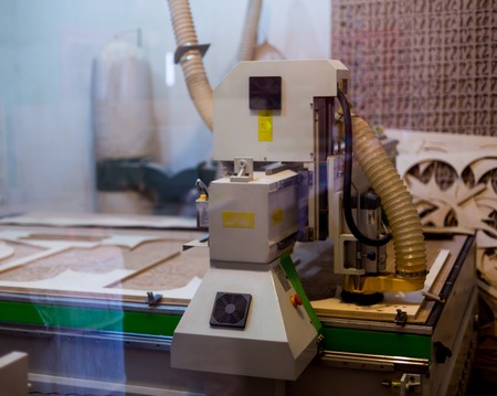 Carpenters tools background. Old fashioned rusty carpenters tools lying under wooden tile boards composition. A hammer lying on a carpenters table with furniture detailsの写真素材