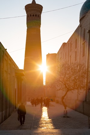 Architecture of medieval buildings of Madrasah at evening. Bukhara, Uzbekistan, Central Asia.