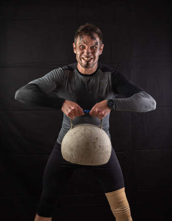 Handsome Athletic Men Exercising With big Kettlebellの写真素材