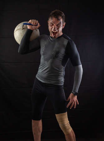 Handsome Athletic Men Exercising With big Kettlebellの写真素材