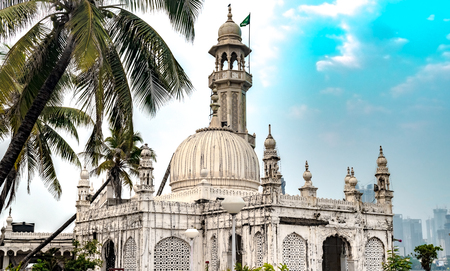 Famous Sufi Shrine of Pir Haji Ali Shah Bukhari known as Haji Ali Dargah. Made up of Marble in typical Indo-Islamic architecture, this shrine, a tourist spot is situated off the Worli Coast in Mumbaiの写真素材