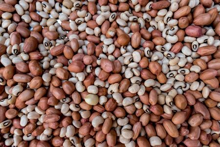 Heap of raw peanut and soybean seeds. An important ingredient of sprouts and rich source of protein,...